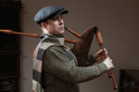 The man in Blue Sean Tweed Cap by Hanna Hats and  Patch-brown Tweed Scarf by Hanna Hats